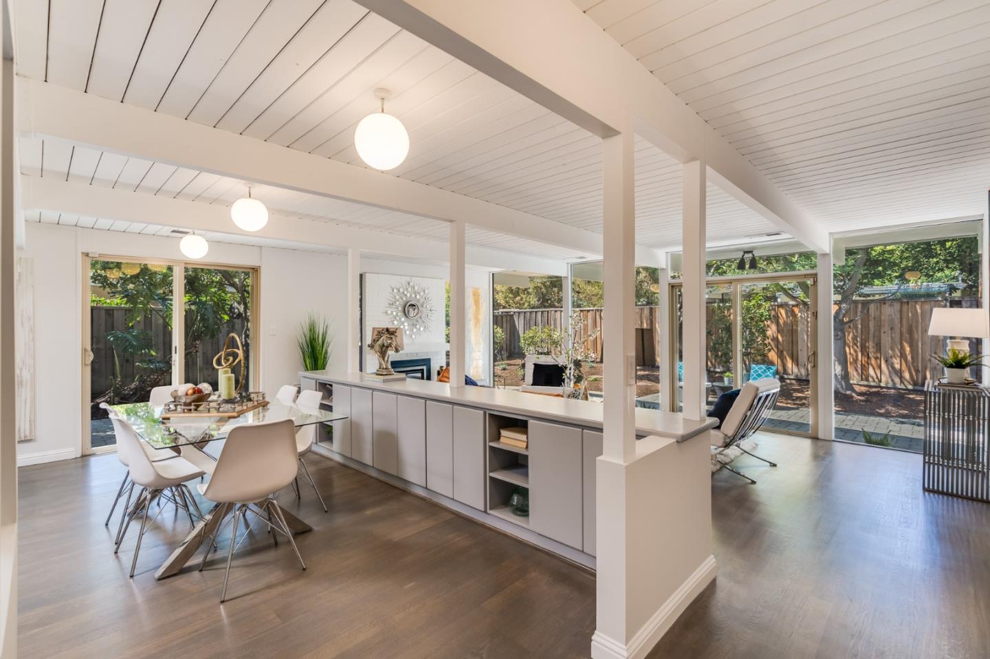 3924 Louis Road Palo Alto, CA 94303 - Photo 5 of 37 a view of a dining room with furniture wooden floor and chandelier