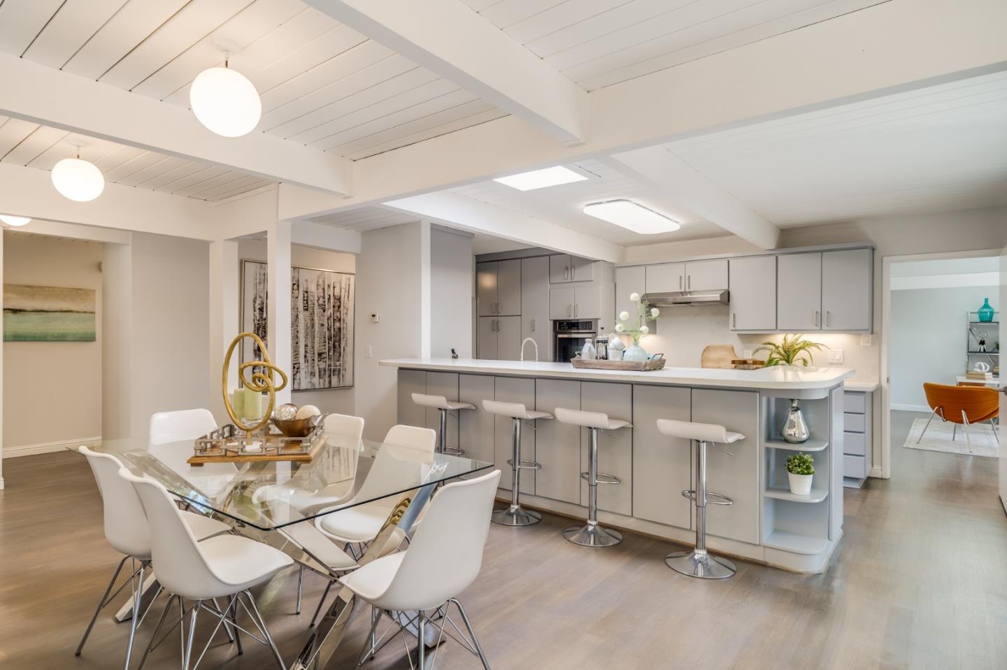 3924 Louis Road Palo Alto, CA 94303 - Photo 8 of 37 a kitchen with white cabinets and chairs