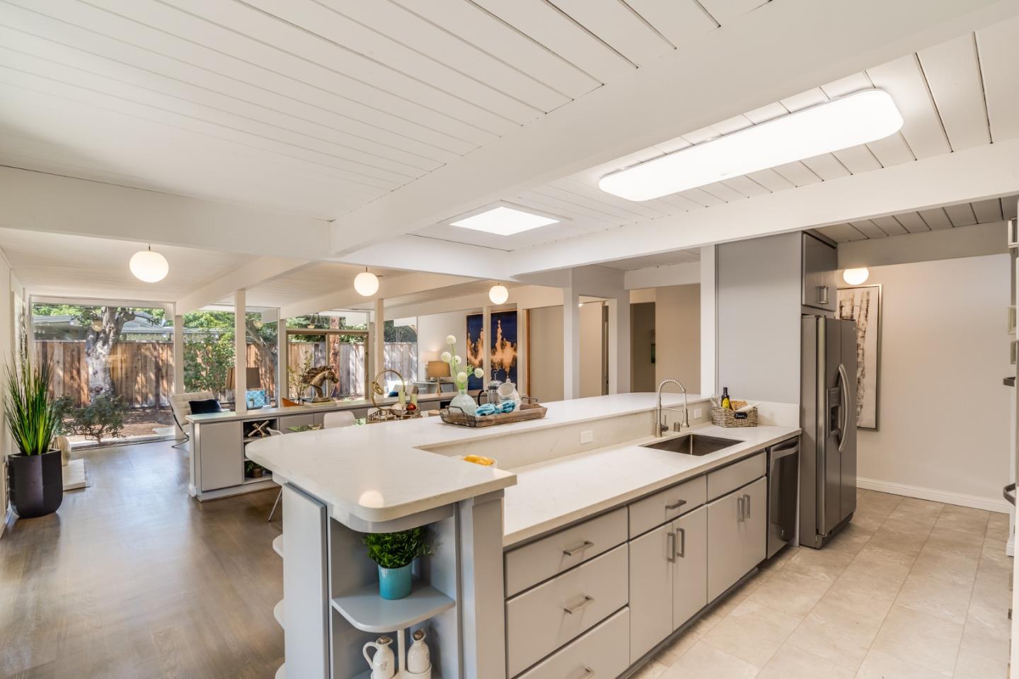 3924 Louis Road Palo Alto, CA 94303 - Photo 10 of 37 a view of a kitchen with kitchen island granite countertop lots of counter top space