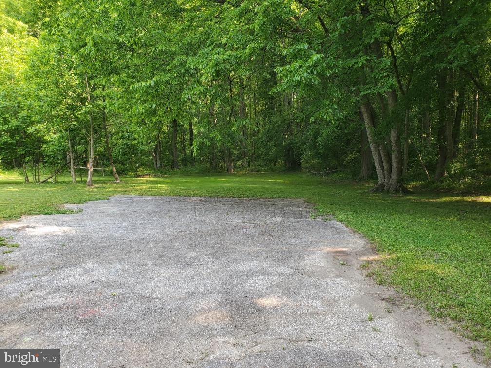 1303 Caldwell Corner Road Townsend, DE 19734 - Photo 4 of 9 a view of outdoor space with deck and yard