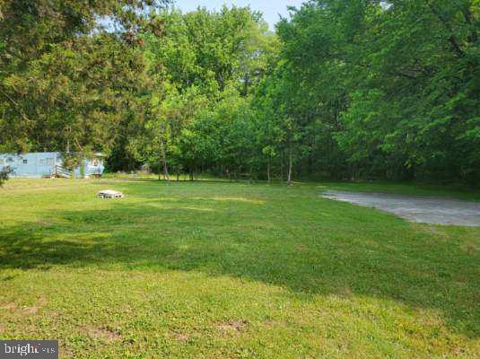 1303 Caldwell Corner Road Townsend, DE 19734 - Photo 9 of 9 a view of outdoor space with deck and yard