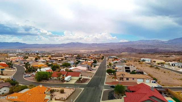 an aerial view of residential houses with outdoor space