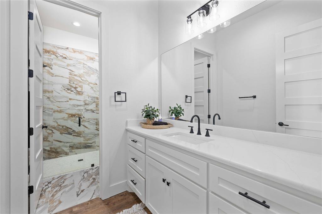 584 Oak Point Drive May, TX 76857 - Photo 23 of 40 a bathroom with a sink and a mirror