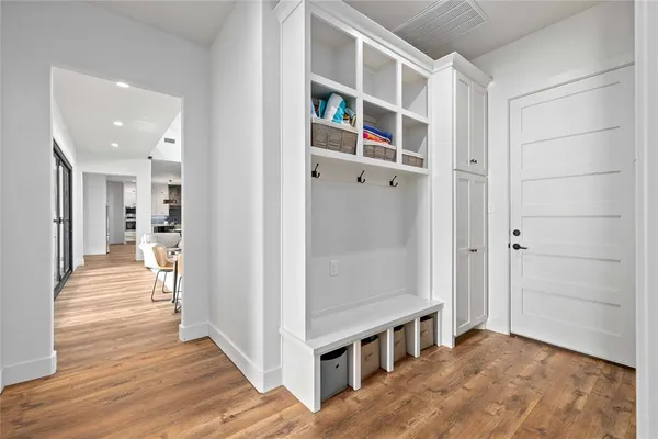 a spacious bathroom with a double vanity sink and a mirror