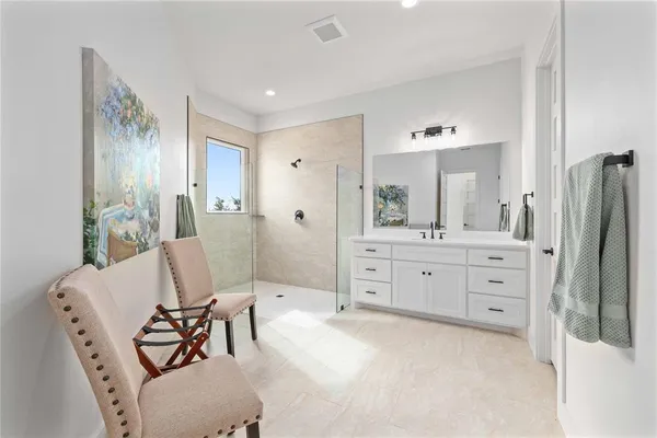 a bedroom with a bed and a table