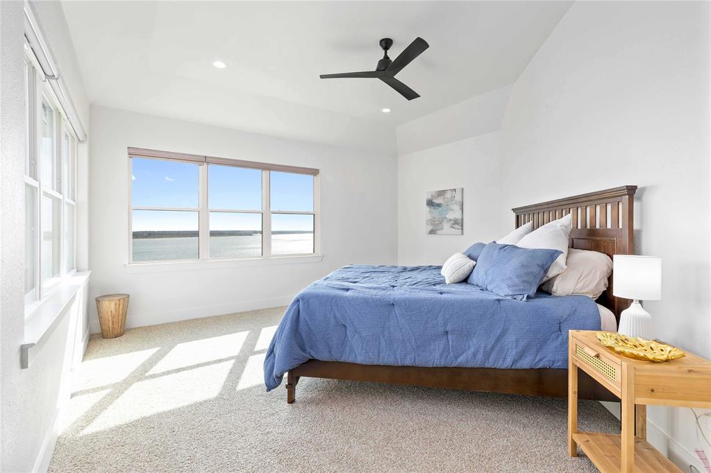 584 Oak Point Drive May, TX 76857 - Photo 32 of 40 a bedroom with a bed and a window