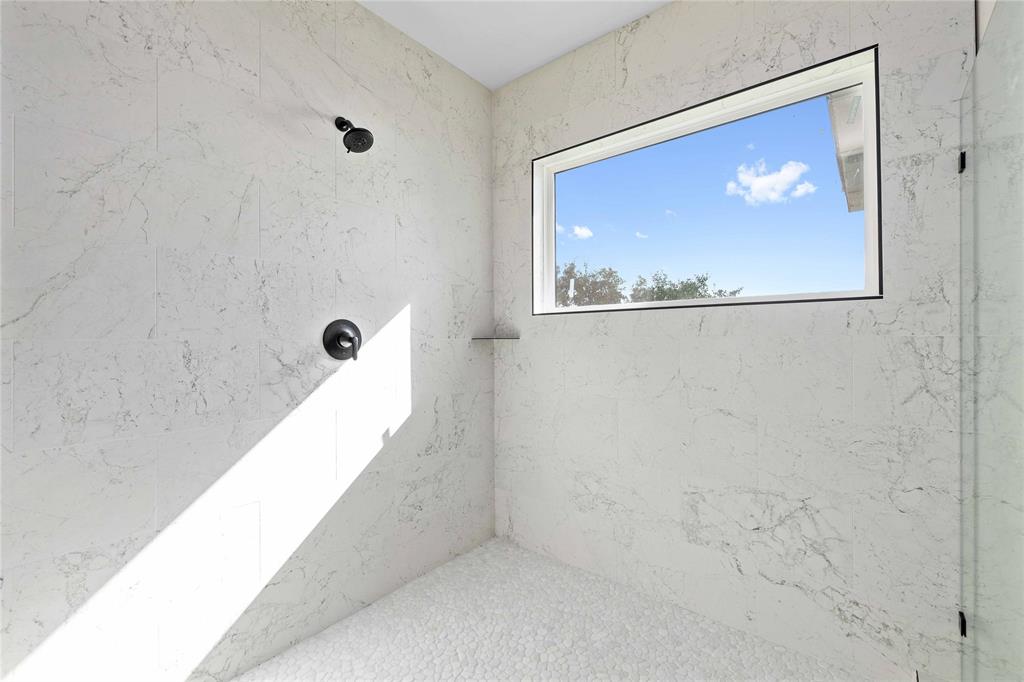 584 Oak Point Drive May, TX 76857 - Photo 34 of 40 a bathroom with a bathtub and shower