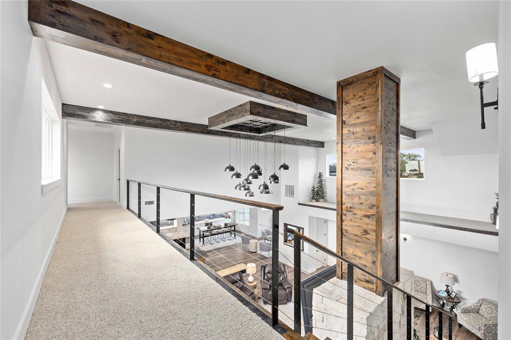 584 Oak Point Drive May, TX 76857 - Photo 36 of 40 a view of a hallway with wooden floor and staircase