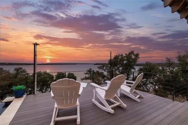 a living room with fireplace furniture and a wooden floor