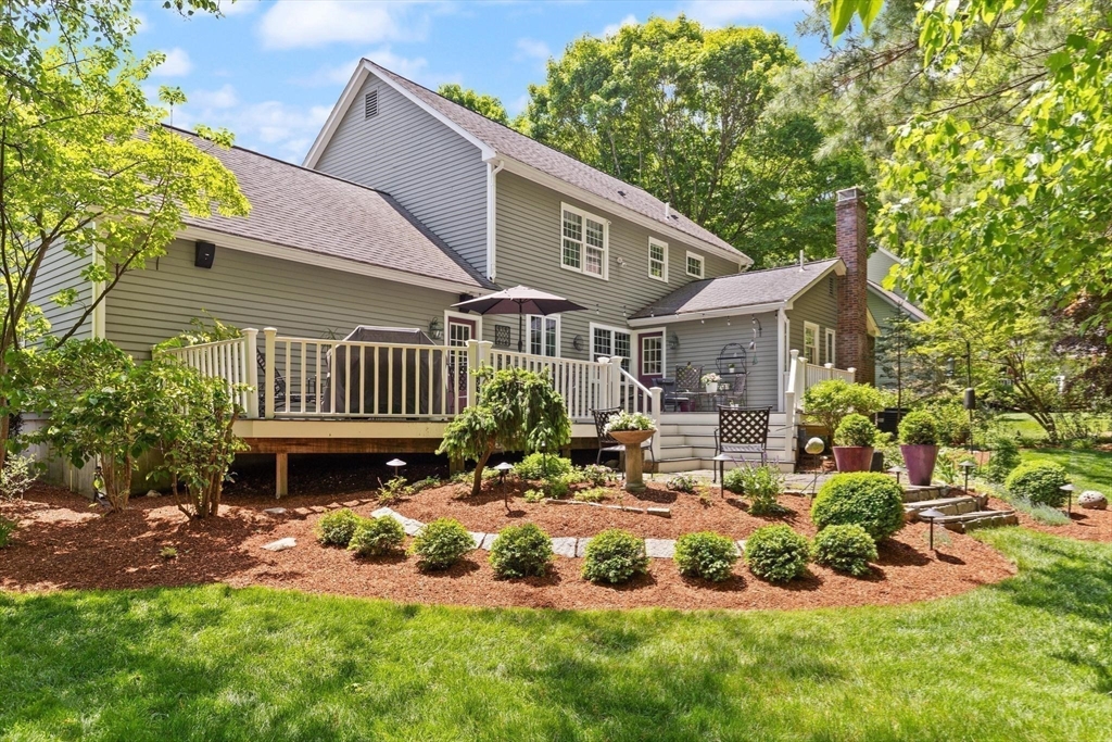 67 Bridle Path Franklin, MA 02038 - Photo 31 of 35 a front view of a house with a yard table and chairs