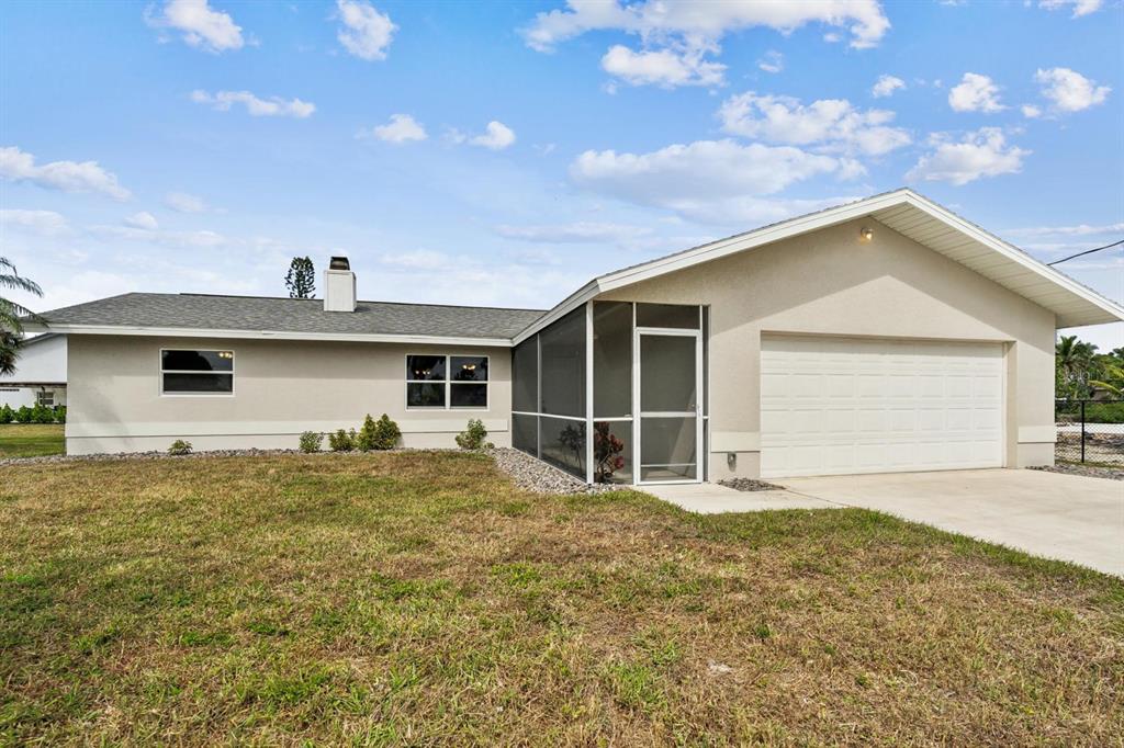 6064 Park Road Fort Myers, FL 33908 - Photo 14 of 14 front view of a house with a yard