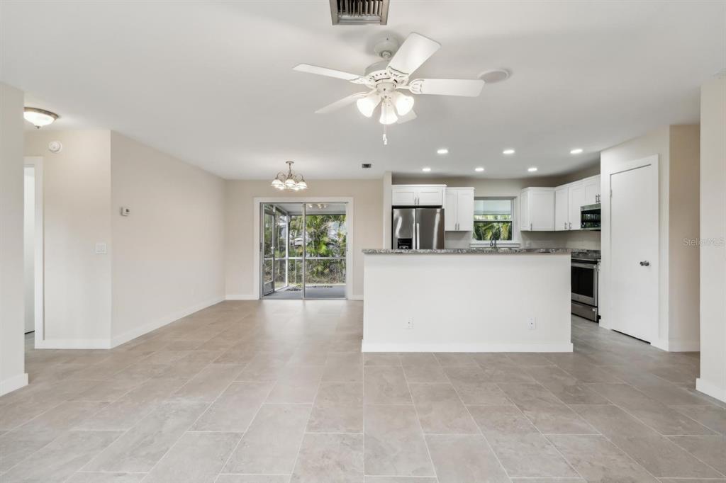 6064 Park Road Fort Myers, FL 33908 - Photo 4 of 14 a view of a kitchen with kitchen island and stainless steel appliances