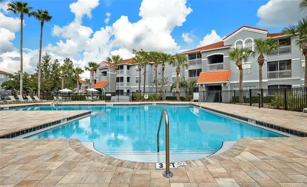 a view of a swimming pool with a patio