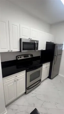 a kitchen with a sink and a stove