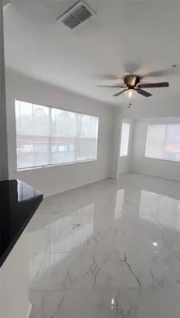 a view of an empty room with a window