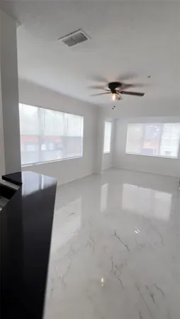 a view of an empty room with a window