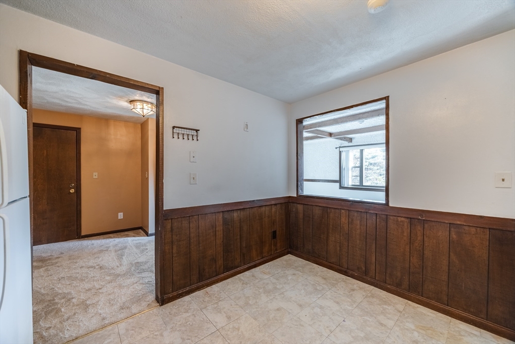 41 Spencer Road, Unit 26G Boxborough, MA 01719 - Photo 16 of 35 a view of an empty room with wooden door