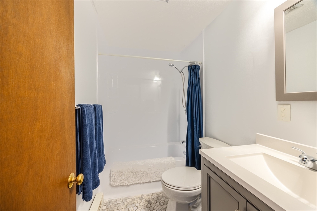 41 Spencer Road, Unit 26G Boxborough, MA 01719 - Photo 18 of 35 a bathroom with a sink a toilet and shower