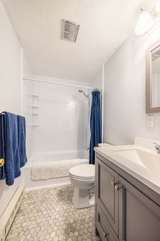 41 Spencer Road, Unit 26G Boxborough, MA 01719 - Photo 19 of 35 a bathroom with a sink toilet vanity and shower