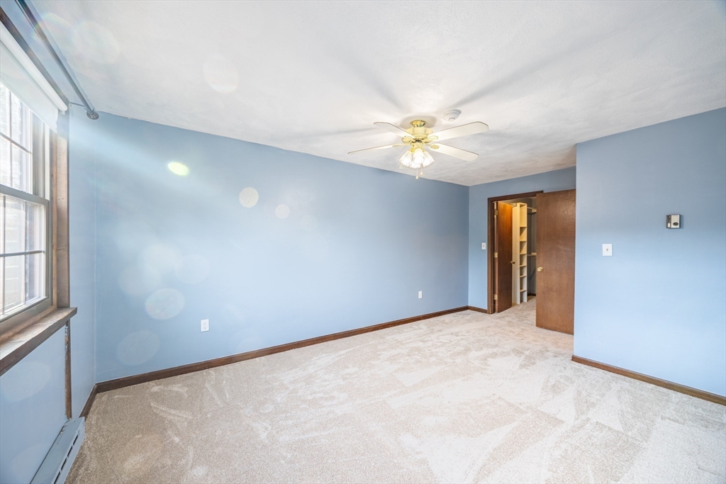 41 Spencer Road, Unit 26G Boxborough, MA 01719 - Photo 23 of 35 a view of an empty room with a window