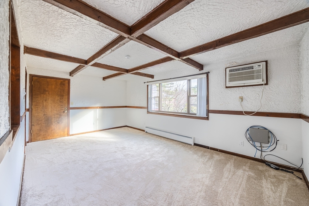 41 Spencer Road, Unit 26G Boxborough, MA 01719 - Photo 4 of 35 a view of an empty room with a window
