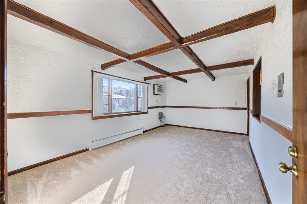 41 Spencer Road, Unit 26G Boxborough, MA 01719 - Photo 5 of 35 a view of an empty room with a window