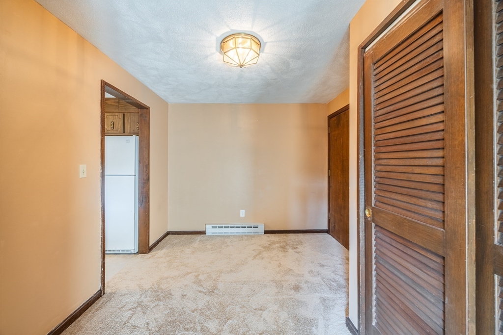 41 Spencer Road, Unit 26G Boxborough, MA 01719 - Photo 9 of 35 a view of an empty room with a window