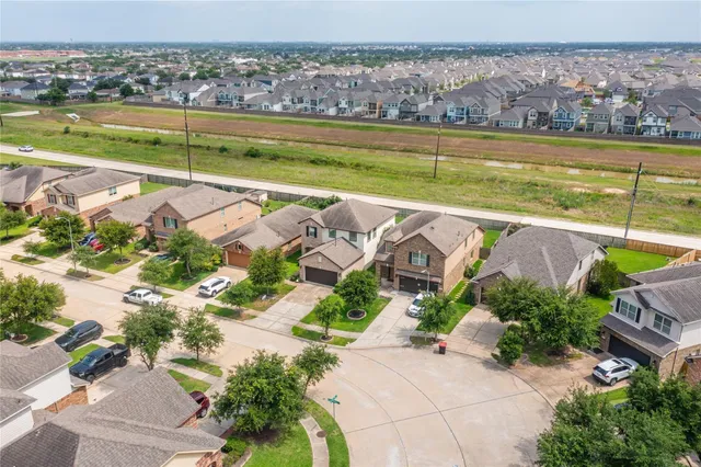 an aerial view of a city with a lake view