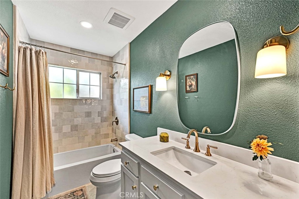 3210 Iowa Street Costa Mesa, CA 92626 - Photo 13 of 18 a bathroom with a toilet sink and mirror