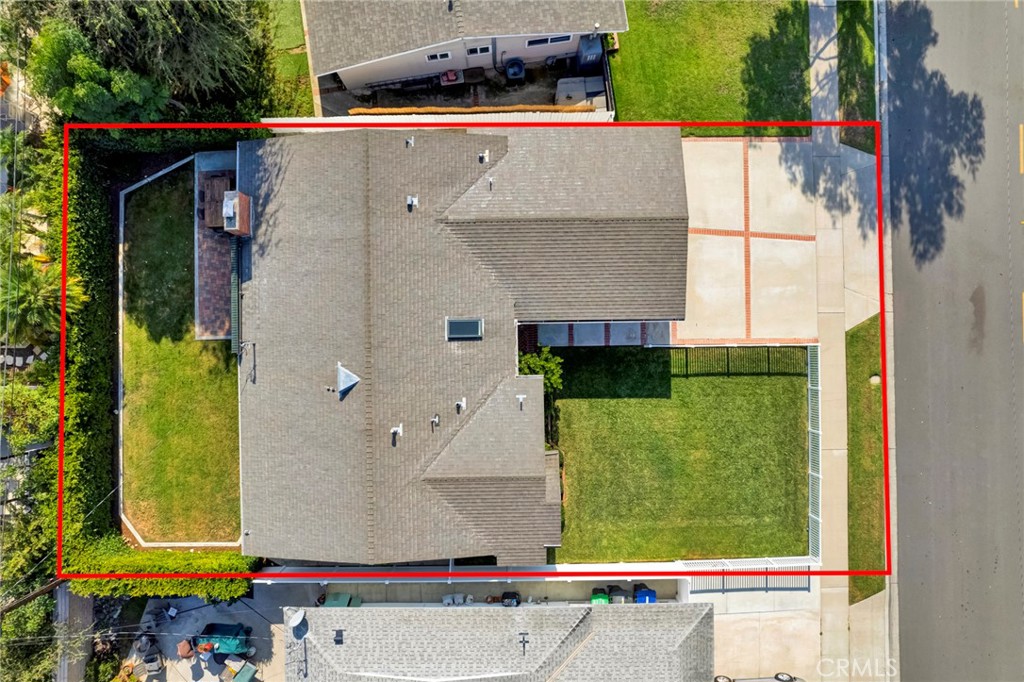 3210 Iowa Street Costa Mesa, CA 92626 - Photo 17 of 18 an aerial view of a house with a yard and a garage