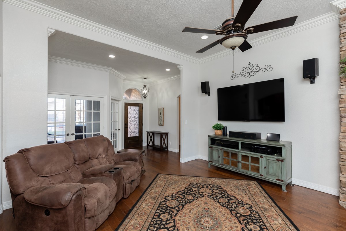 665 Winchester Drive Bridge City, TX 77611 - Photo 22 of 39 a living room with furniture and a flat screen tv