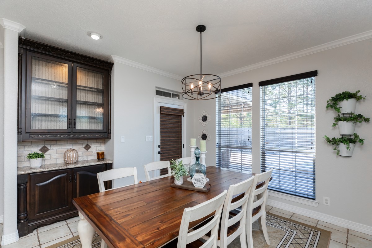 665 Winchester Drive Bridge City, TX 77611 - Photo 29 of 39 a view of a dining room with furniture window and wooden floor