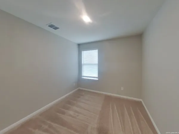 a view of room with window and closet