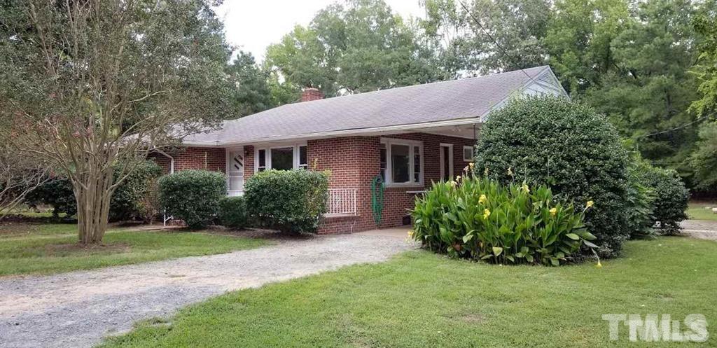 2925 Mt Moriah Road Durham, NC 27707 - Photo 1 of 18 a view of house with yard and green space
