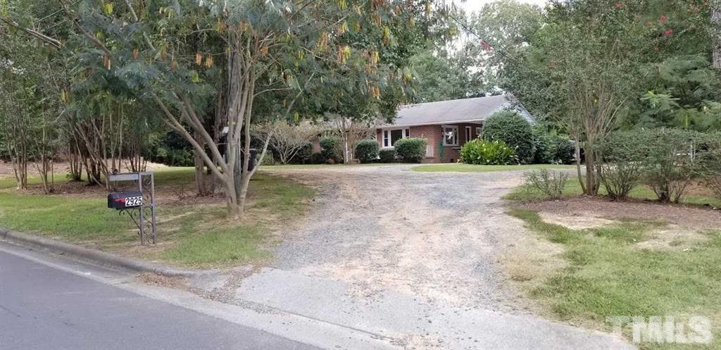 2925 Mt Moriah Road Durham, NC 27707 - Photo 15 of 18 a backyard of a house with table and chairs
