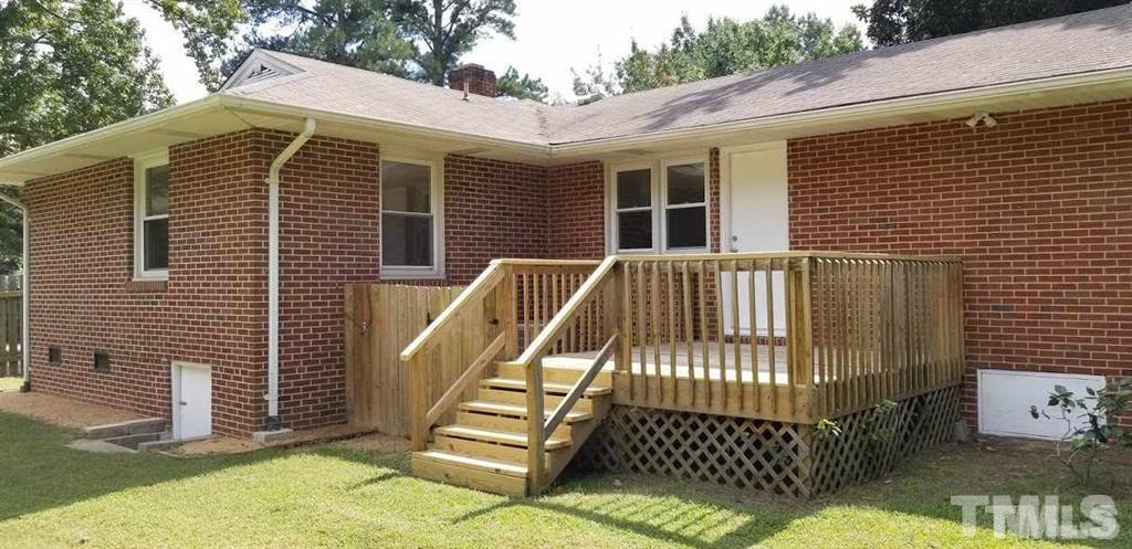 2925 Mt Moriah Road Durham, NC 27707 - Photo 16 of 18 a front view of a house with a garden