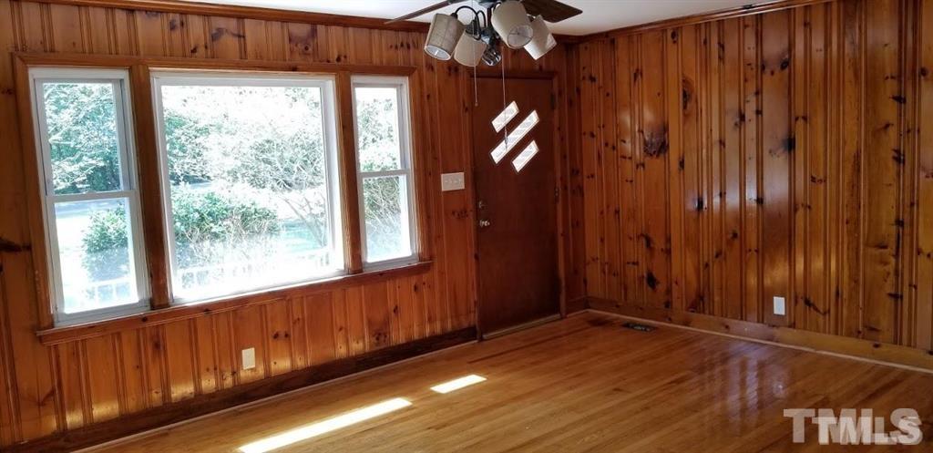 2925 Mt Moriah Road Durham, NC 27707 - Photo 6 of 18 a view of a room with wooden floor and windows