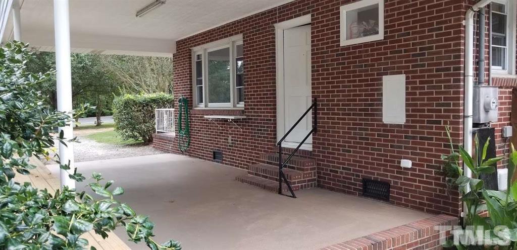 2925 Mt Moriah Road Durham, NC 27707 - Photo 8 of 18 a view of a house with backyard and garden