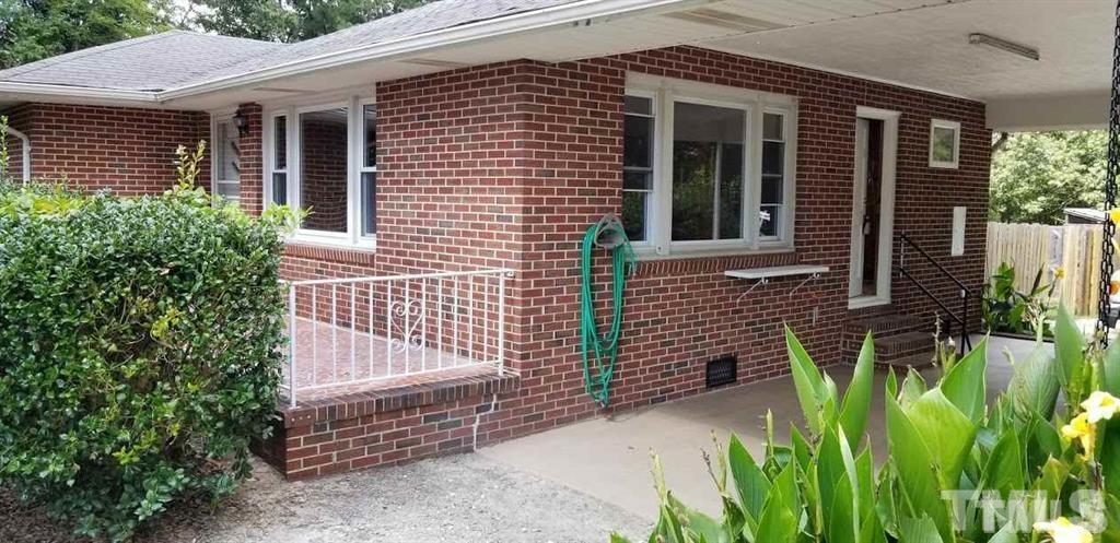 2925 Mt Moriah Road Durham, NC 27707 - Photo 9 of 18 a front view of a house with a garden