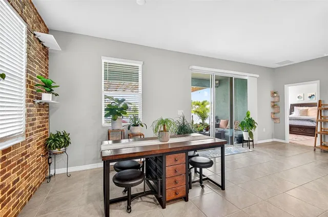 a view of a dining room with furniture and window