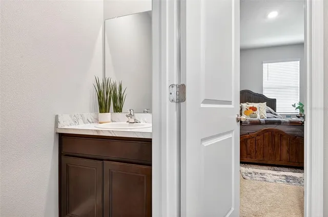 a kitchen with stainless steel appliances a sink stove and refrigerator