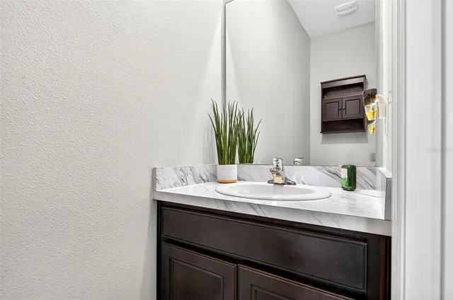 a close up of a mirror and a sink