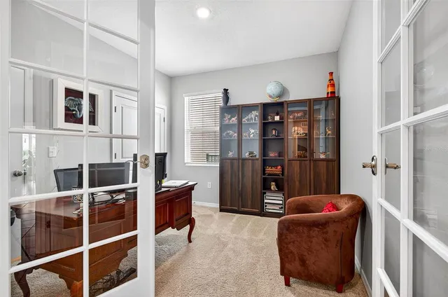 a living room with furniture cabinets and walk in closet