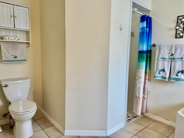 a bathroom with a toilet and a sink