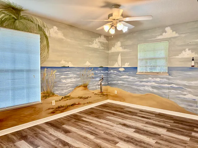 a view of a livingroom with wooden floor and closet
