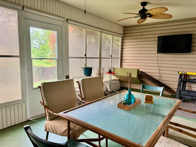 a kitchen with stainless steel appliances kitchen island granite countertop a sink and cabinets
