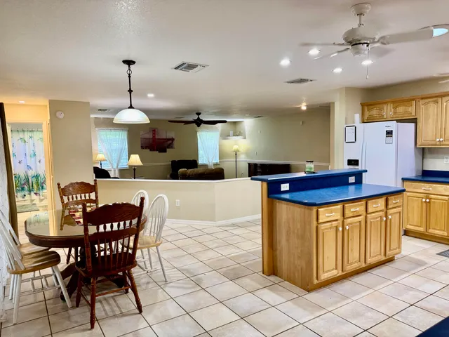 a kitchen with stainless steel appliances a sink and a refrigerator