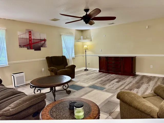 a kitchen with stainless steel appliances granite countertop a sink and a refrigerator