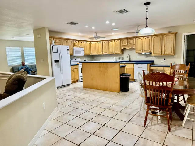 a kitchen with stainless steel appliances granite countertop a sink and cabinets