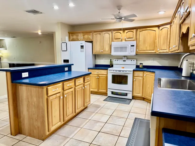 a bathroom with a sink a mirror and a shower